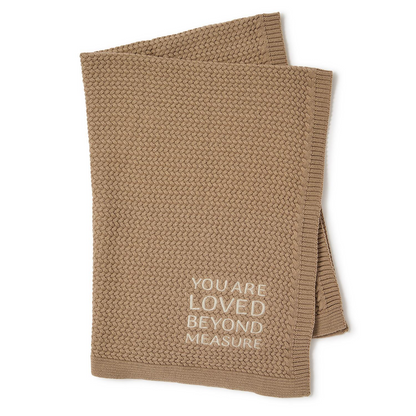 Mellow Monkey taupe soft cotton knit baby blanket featuring the embroidered text You Are Loved Beyond Measure