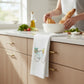 Mellow Monkey Teal Bike Crabs & Corn Flour Sack Towel, 100% cotton, 27" x 27", highly absorbent, lint-free, and soft.