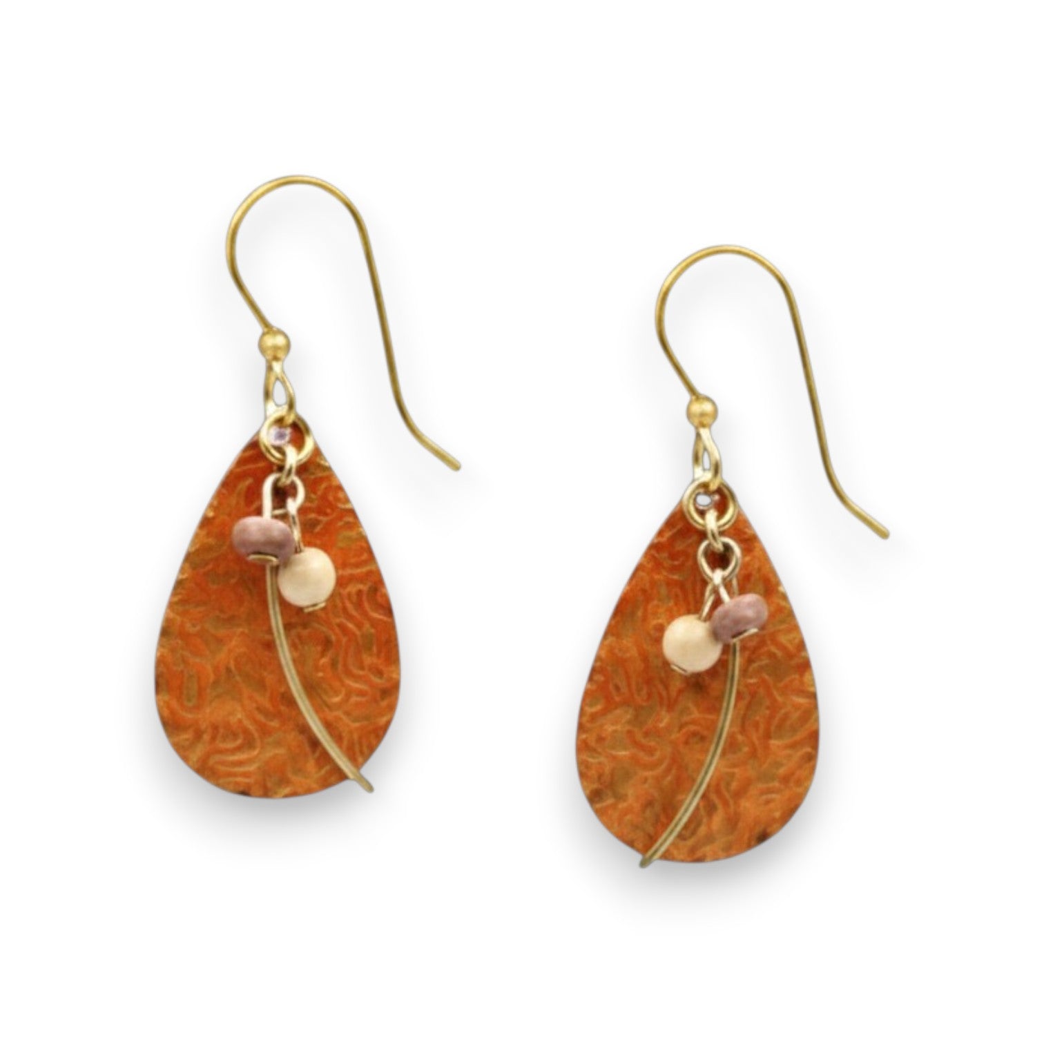 Mellow Monkey teardrop earrings with orange textured metal, gold-tone wisps, and small beads on surgical steel wires.