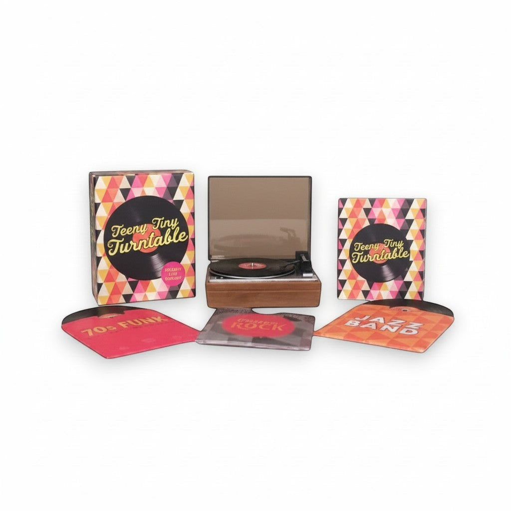 Mellow Monkey Teeny-Tiny Turntable kit with mini record player, three records, sleeves, and decorative stickers.
