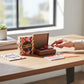 Mellow Monkey Teeny-Tiny Turntable mini record player kit with three miniature vinyl records on a wooden desk.