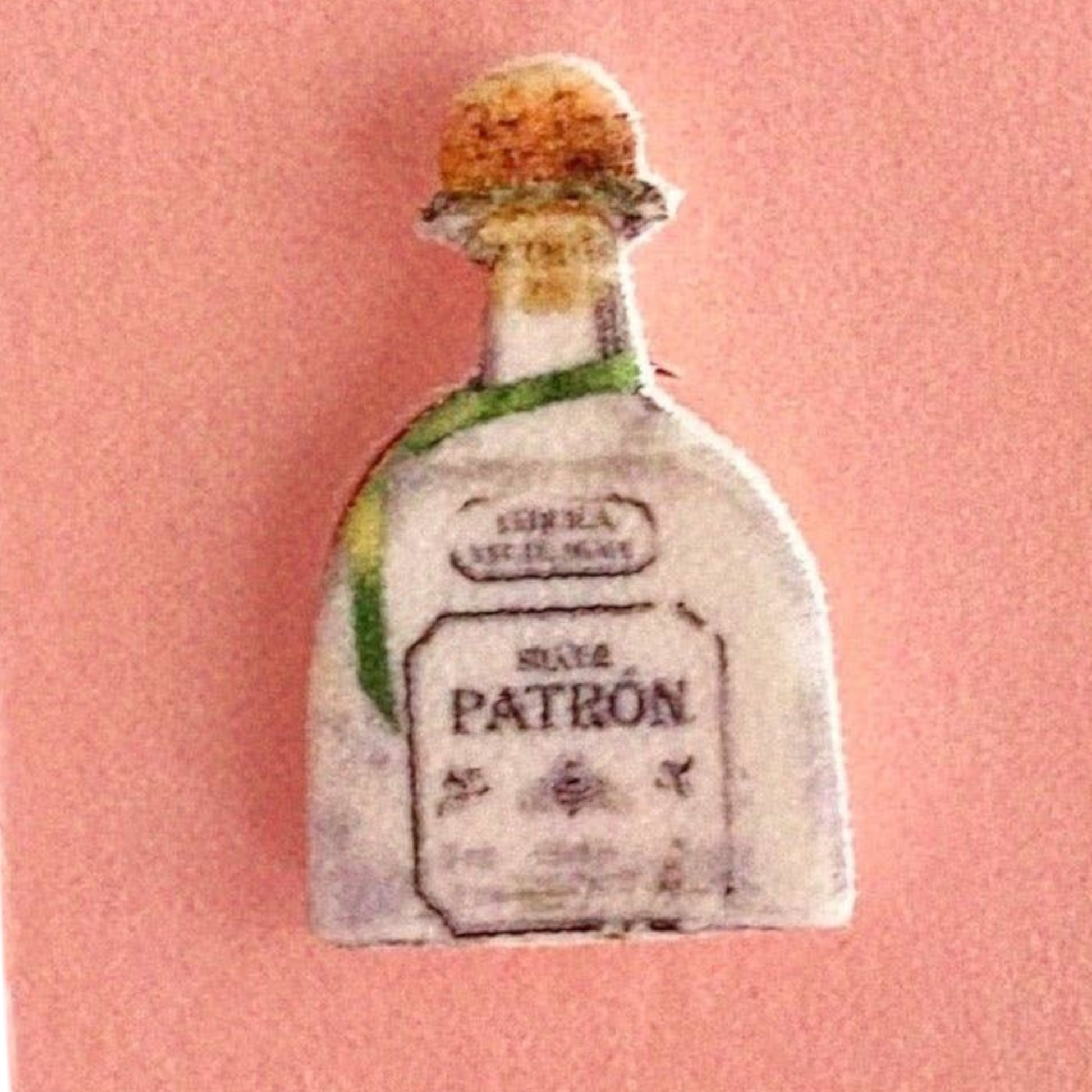 Mellow Monkey handmade tequila bottle and lime wedge stud earrings on a pink display card with stainless steel posts.