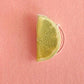 Mellow Monkey handmade tequila bottle and lime wedge stud earrings on a pink display card with stainless steel posts.