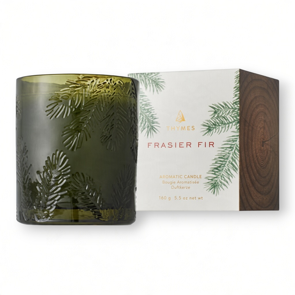 Mellow Monkey Thymes Frasier Fir candle in a textured green glass jar with its decorative pine-themed box.