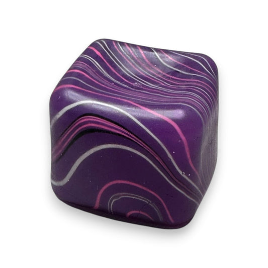Mellow Monkey 2-inch purple tie-dye stress relief cube with glittery swirl patterns for sensory fidget play.