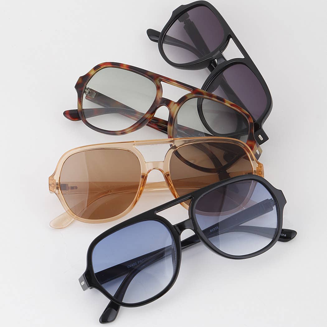 Mellow Monkey aviator sunglasses in assorted colors including black, tortoise shell, and translucent brown frames.