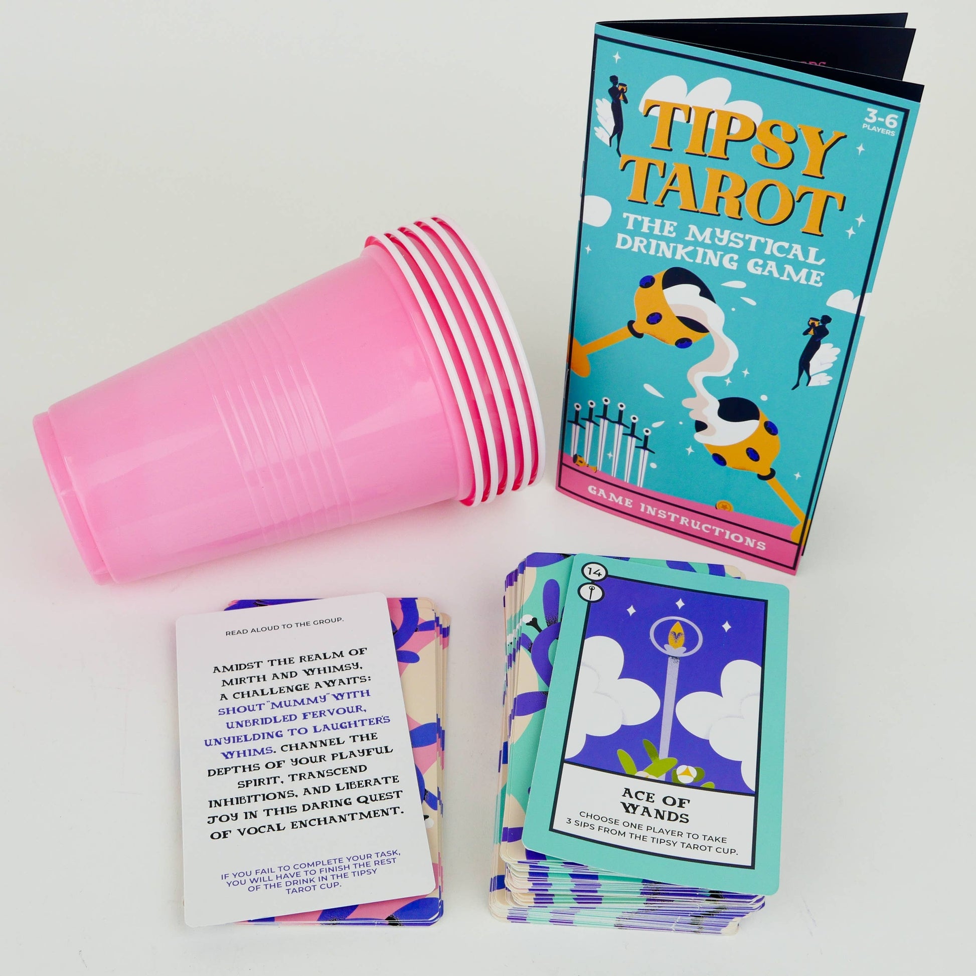 Mellow Monkey Tipsy Tarot drinking game set with pink plastic cups, instruction booklet, and illustrated tarot cards.