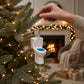 Mellow Monkey white blown glass toilet ornament with blue glitter seat hanging on a Christmas tree