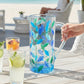 Mellow Monkey Tree of Life Venetian glass pitcher in aqua blue and green hand-painted leaf design. 47 oz capacity.