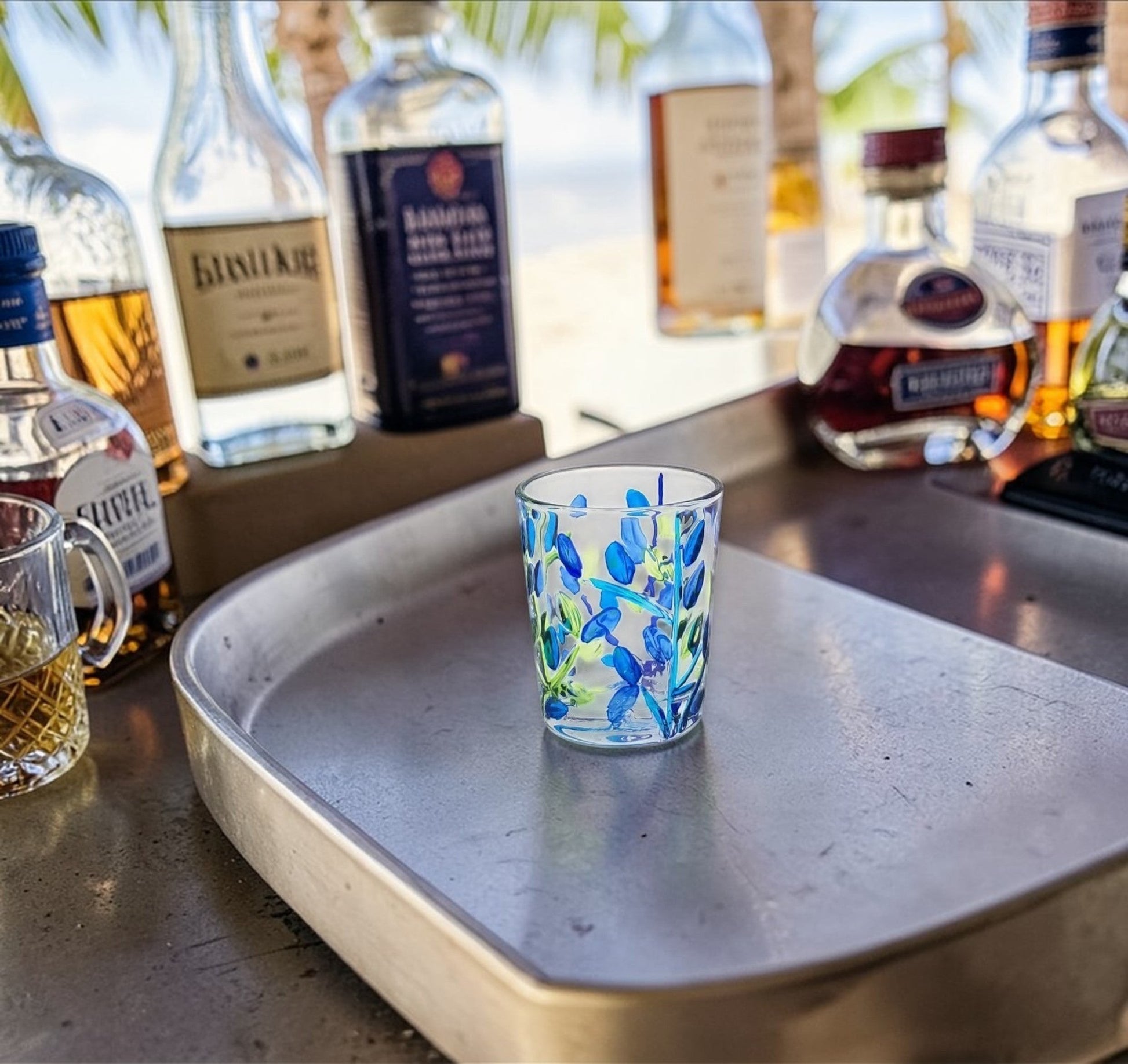 Mellow Monkey aqua Venetian glass shot glass with hand-painted blue and green tree of life design. 2.5 oz.