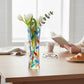 Mellow Monkey Tree of Life Venetian glass bud vase, 7-inch, hand-painted with multi-colored leaves and tulips.