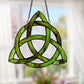 Mellow Monkey Trinity Knot stained glass window panel in emerald green and clear glass with a metal hanging chain.