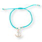 Mellow Monkey Kitt adjustable bracelet featuring a bright turquoise braided band and a gold-tone anchor charm
