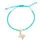Mellow Monkey Kitt adjustable bracelet featuring a turquoise braided band and a gold butterfly charm with crystals.