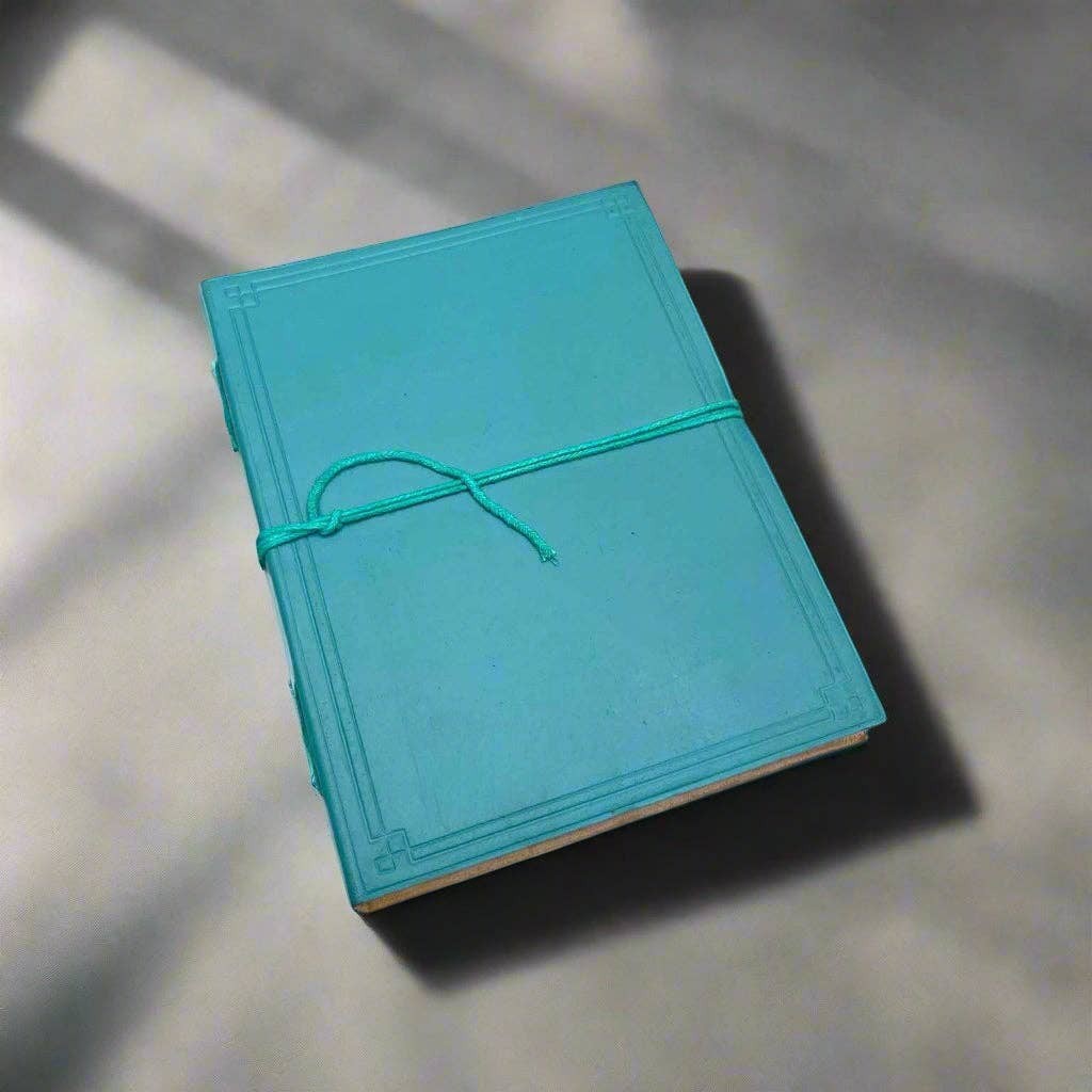 Mellow Monkey turquoise leather journal with debossed corners and elastic closure, 8x6 inches, unlined pages.
