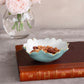 Mellow Monkey turquoise and white scalloped mini bowl with gold trim, filled with mixed nuts.