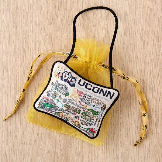 Mellow Monkey woven University of Connecticut mini pillow ornament with UCONN graphics in a yellow gift bag