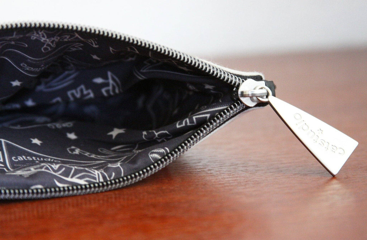 Mellow Monkey University of Georgia zip pouch interior with black patterned lining and silver metal zipper pull