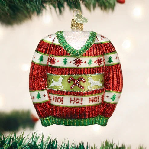 Mellow Monkey 4-inch blown glass ornament shaped like a festive red and green ugly Christmas sweater with reindeer and candy canes.