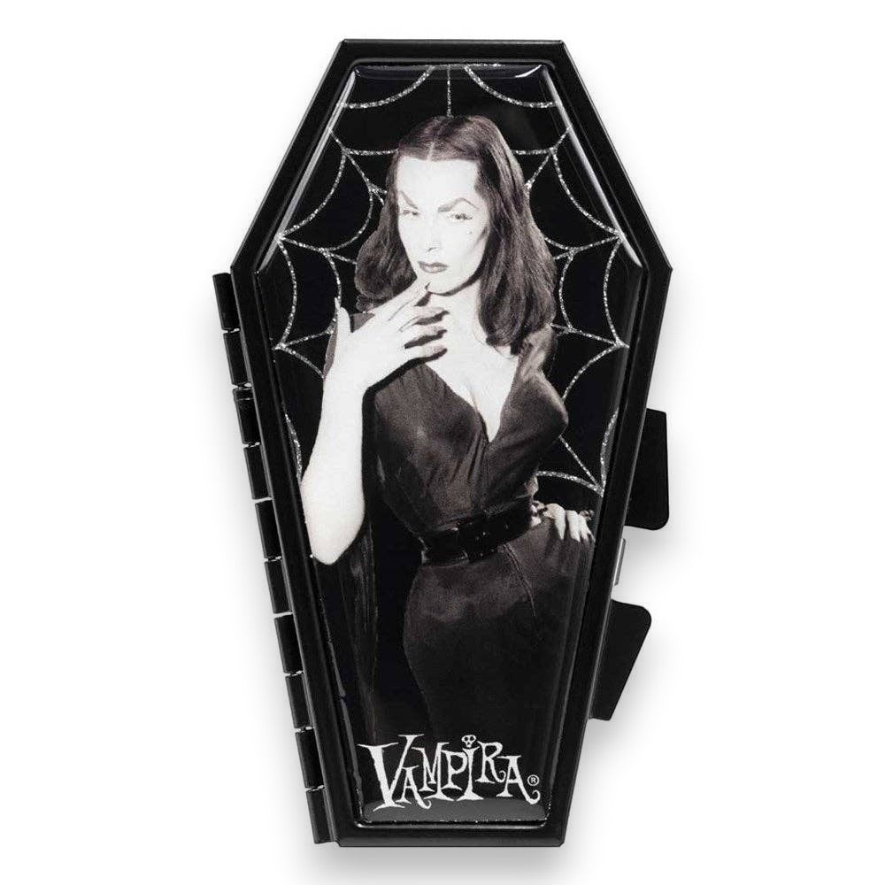Mellow Monkey Vampira coffin-shaped compact mirror featuring a glittery cobweb design and iconic horror imagery.