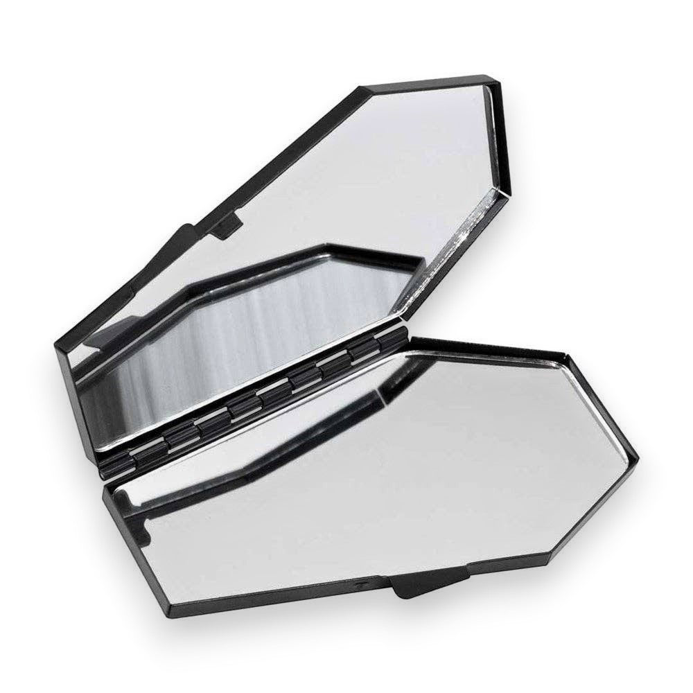 Mellow Monkey Vampira coffin-shaped compact mirror with dual reflective surfaces for gothic makeup touch-ups.
