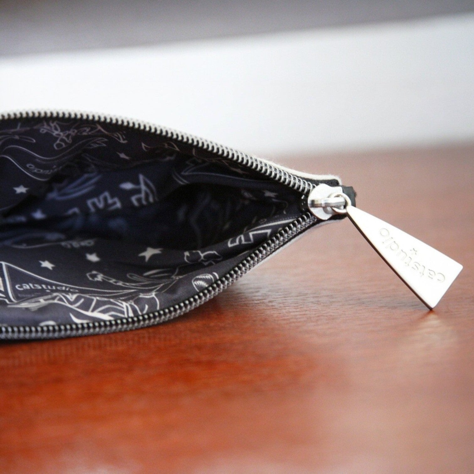 Mellow Monkey Vanderbilt University woven zip pouch with custom silver star zipper pull and collegiate lining.