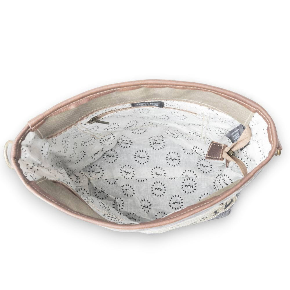Mellow Monkey Vespertine shoulder bag interior view featuring cream canvas lining with black floral print and leather trim