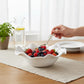 Mellow Monkey VIDA Havana Medium Bowl in white, made of BPA-free melamine, with a ruffled edge, filled with mixed berries.