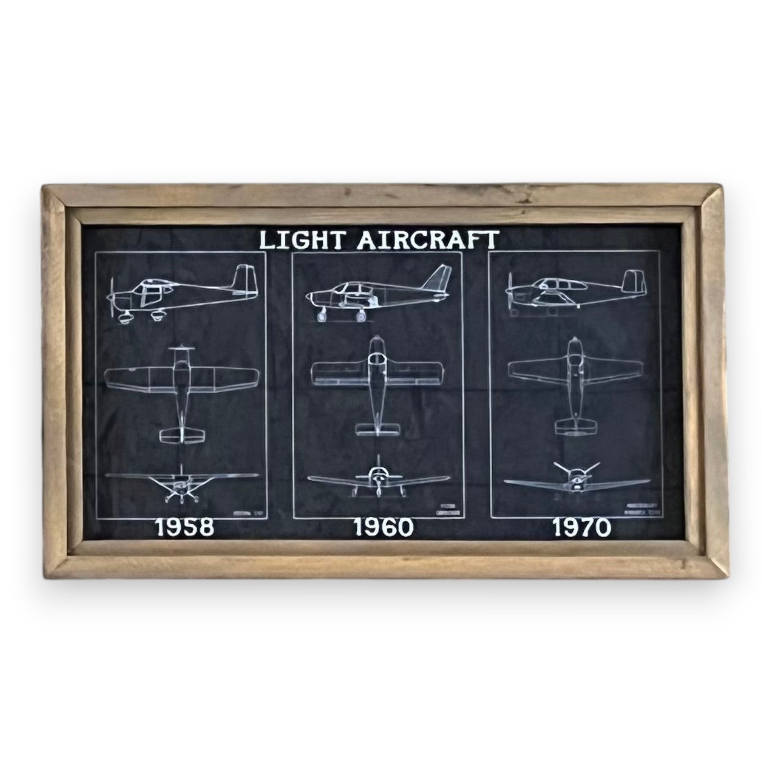 Mellow Monkey vintage light aircraft patent drawings from 1958, 1960, and 1970, framed in dark brown reclaimed wood.