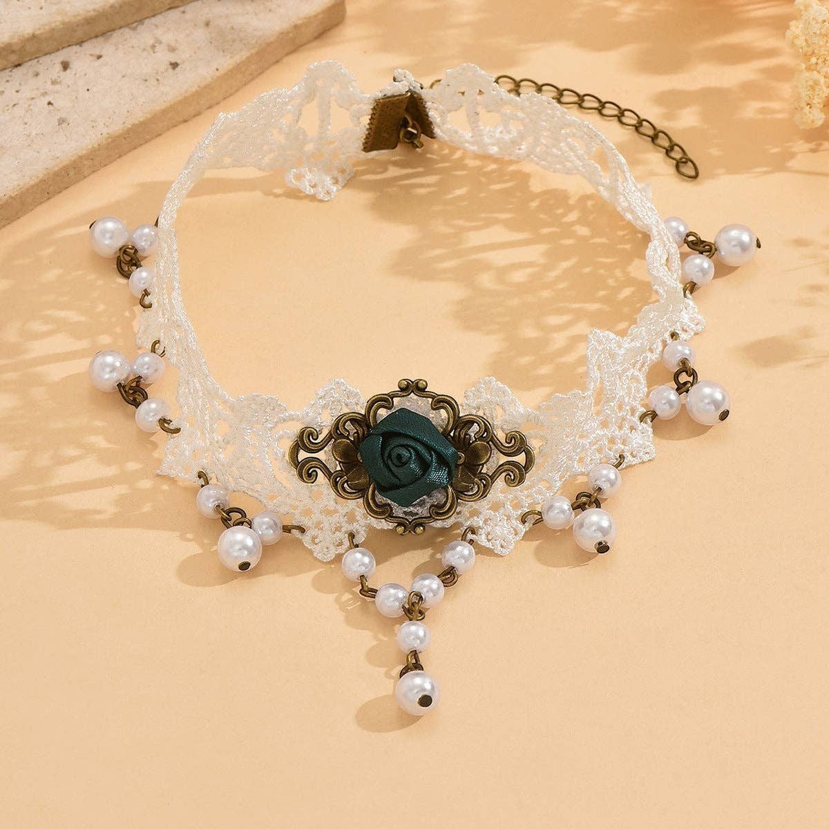 Mellow Monkey vintage-style white lace choker with imitation pearls and a dark green floral rose pendant.
