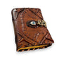 Mellow Monkey Vintage Leather Spellbook with an eye detail and brass clasp. Brown leather, 5x7 inches, 200 pages.
