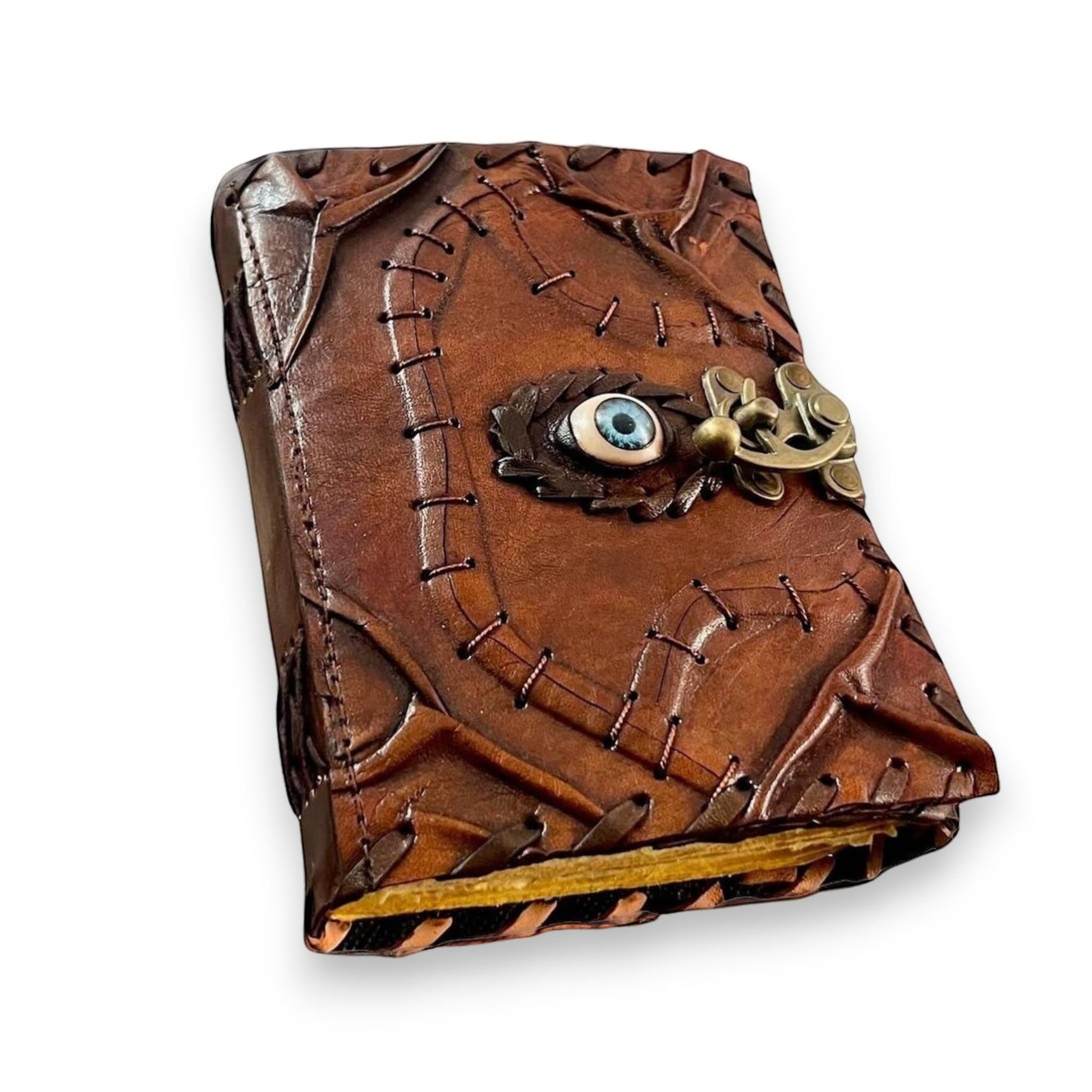 Mellow Monkey Vintage Leather Spellbook with an eye detail and brass clasp. Brown leather, 5x7 inches, 200 pages.