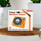 Mellow Monkey retro vinyl record player style kitchen timer in orange packaging on a wooden board