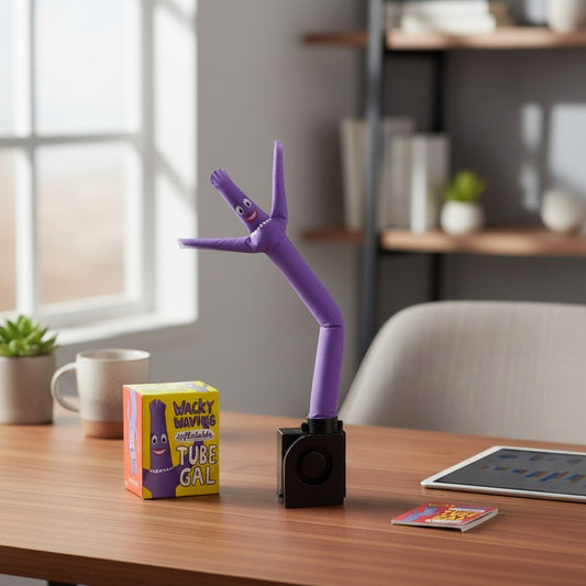 Mellow Monkey Wacky Waving Inflatable Tube Gal purple dancing figure on a desk with its colourful packaging box