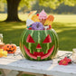 Mellow Monkey Watermelon Pumpkin with candy and ice cream, carved jack o' lantern face, summerween decor