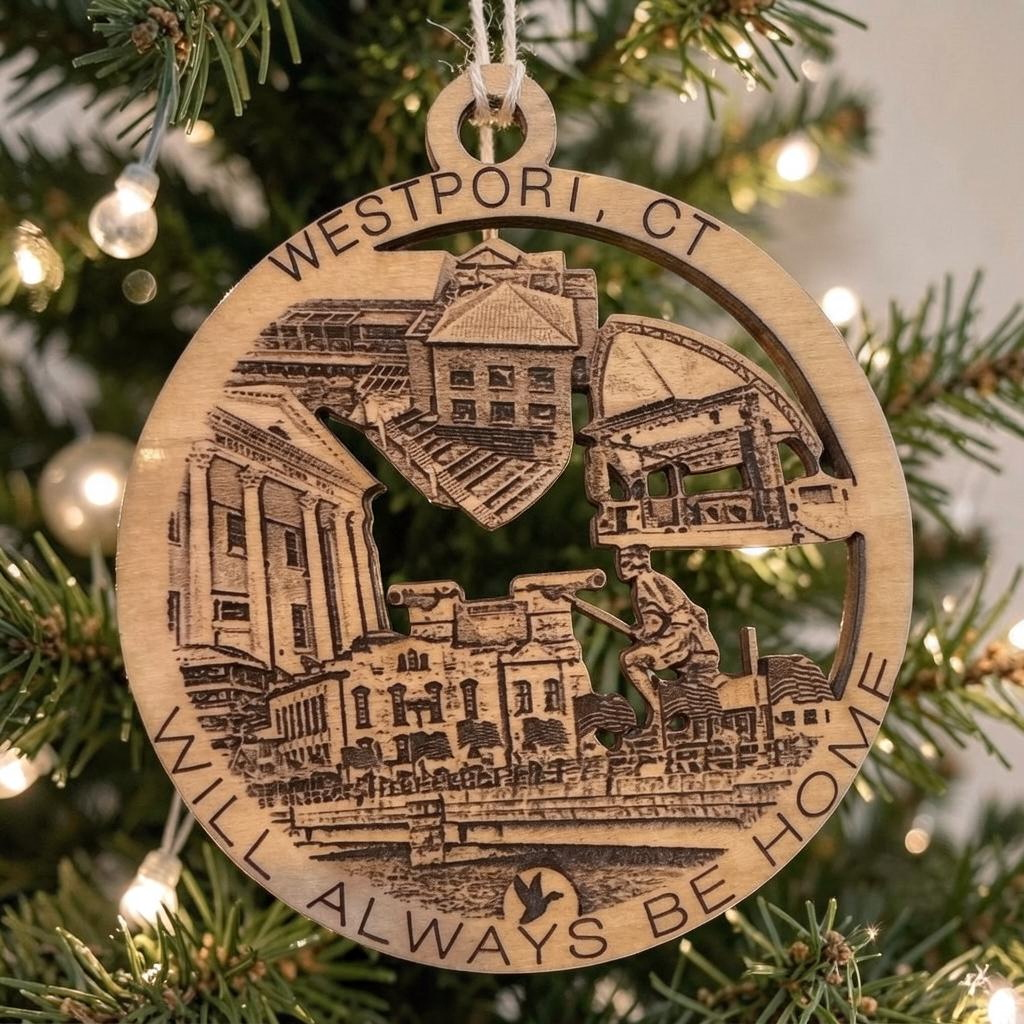 Mellow Monkey Westport CT wooden ornament featuring engraved town landmarks hanging on a Christmas tree branch.