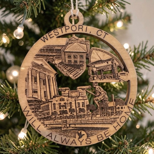 Mellow Monkey Westport CT wooden ornament featuring engraved town landmarks hanging on a Christmas tree branch.