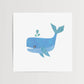 Mellow Monkey blue whale art print with teal accents in a wood frame. Features a playful whale spouting water.