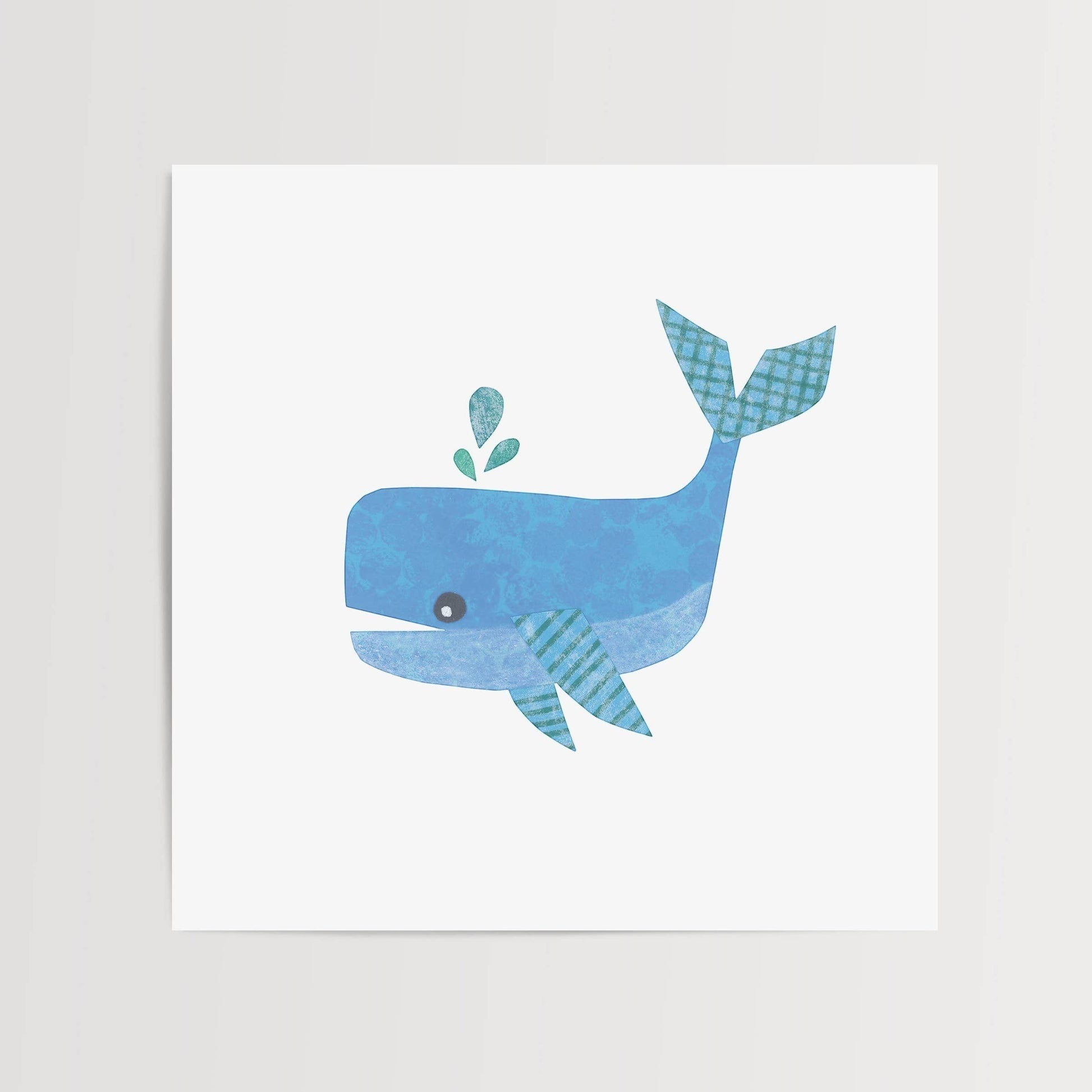 Mellow Monkey blue whale art print with teal accents in a wood frame. Features a playful whale spouting water.