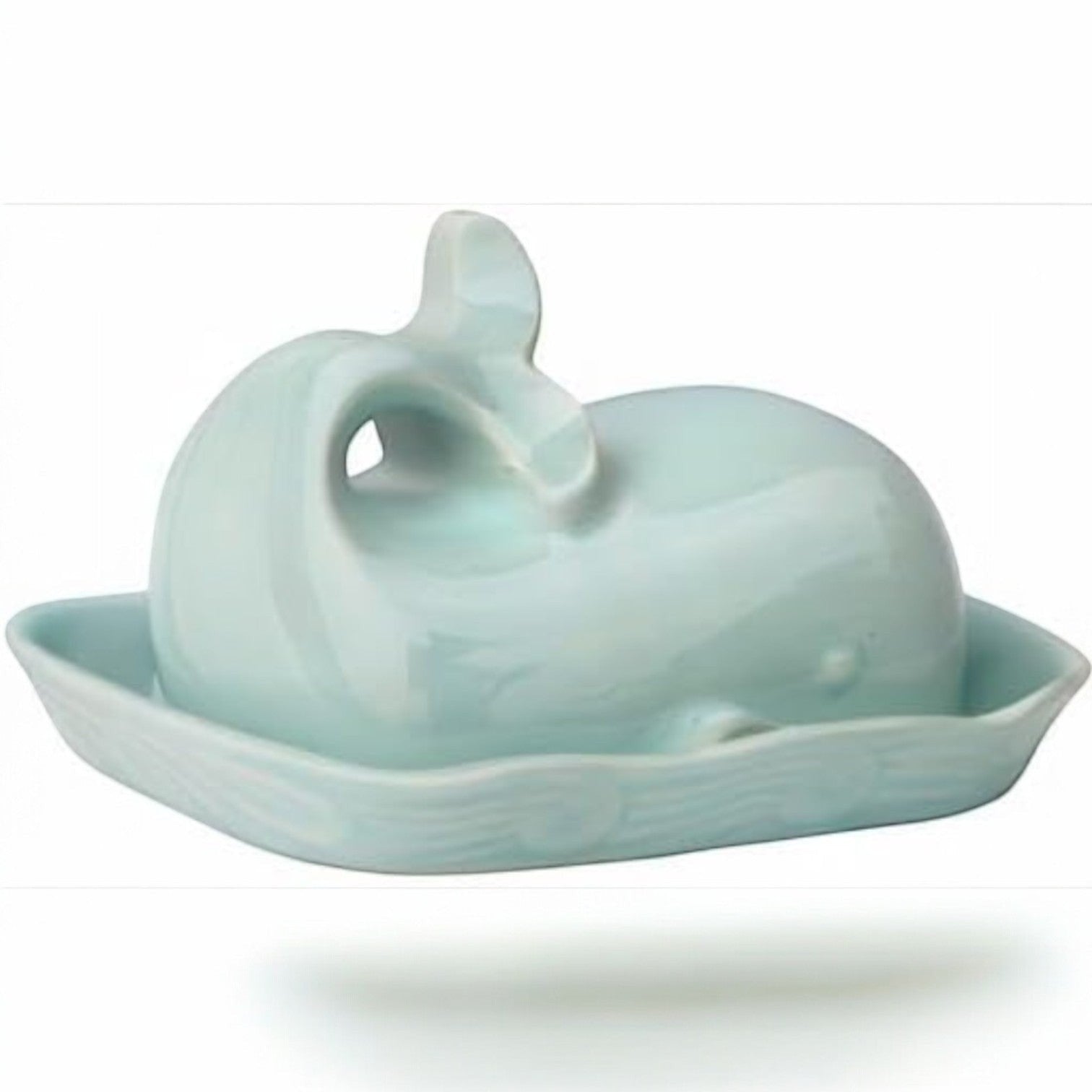 Mellow Monkey aqua ceramic whale butter dish with lid, tail handle, and wave rim detail.