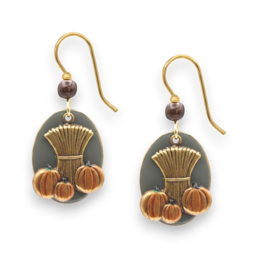 Mellow Monkey Sheaf of Wheat and pumpkin earrings featuring autumn-themed charms on surgical steel ear wires.