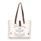 Mellow Monkey white canvas and leather crossbody tote bag with vintage French wine label print and brown handles.