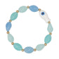 Mellow Monkey coastal bracelet featuring a white fish charm and smooth aqua blue beads on a stretch cord.