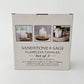 Mellow Monkey set of three white flameless LED pillar candles in glass holders with remote control and timer feature.