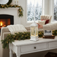Mellow Monkey white plastic holiday lantern with rotating reindeer, swirling glitter, and warm LED lights on a table.