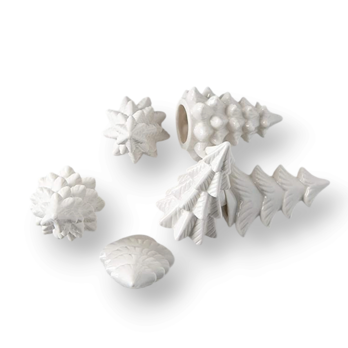 Mellow Monkey set of six small white stoneware Christmas trees for winter holiday mantel and table decor.