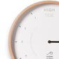 Mellow Monkey 12-inch white wood tide clock with a natural beech frame, white hands, and mineral glass face. Displays hours until high and low tide.