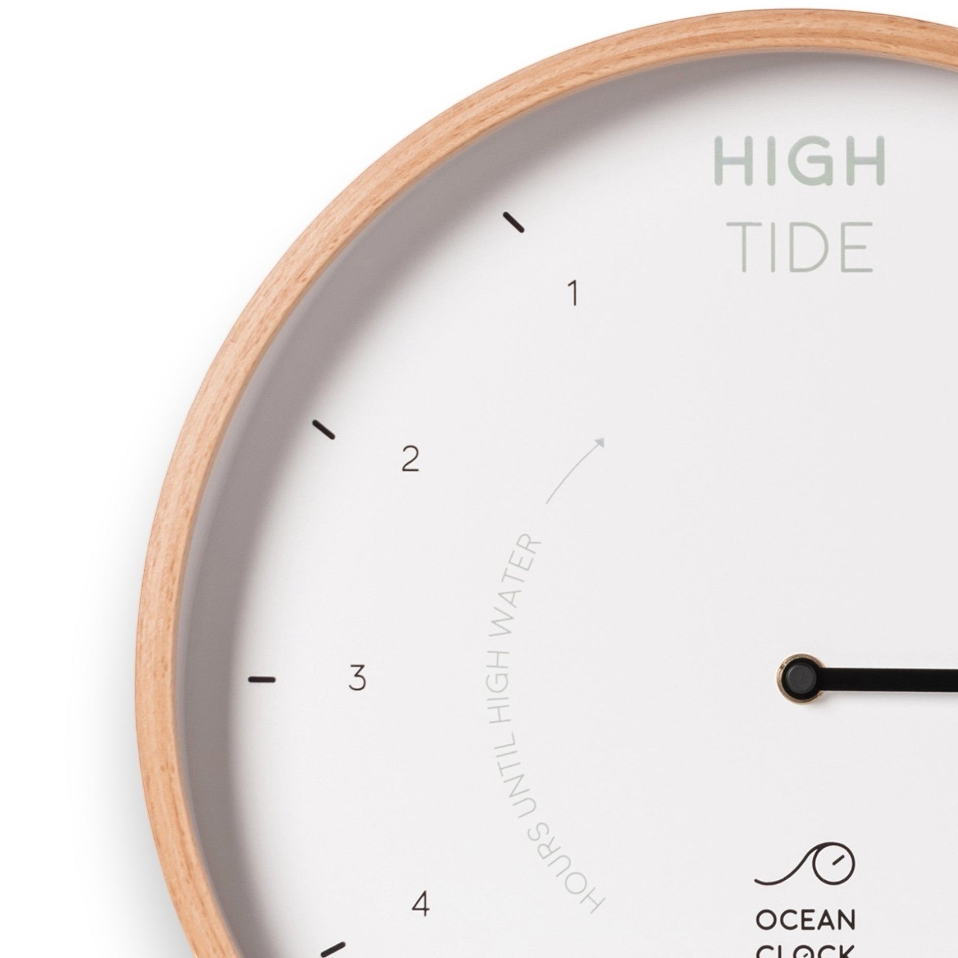 Mellow Monkey 12-inch white wood tide clock with a natural beech frame, white hands, and mineral glass face. Displays hours until high and low tide.