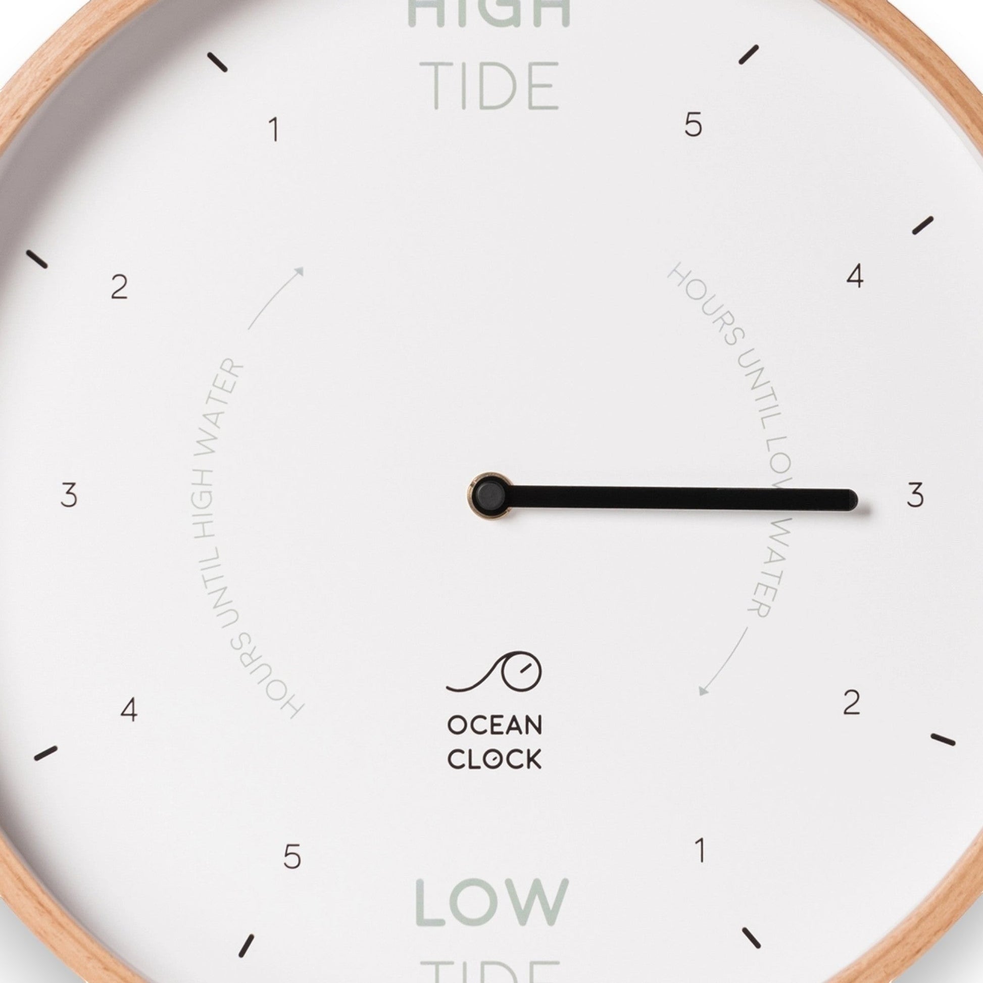 Mellow Monkey 12-inch white wood tide clock with a natural beech frame, white hands, and mineral glass face. Displays hours until high or low tide.