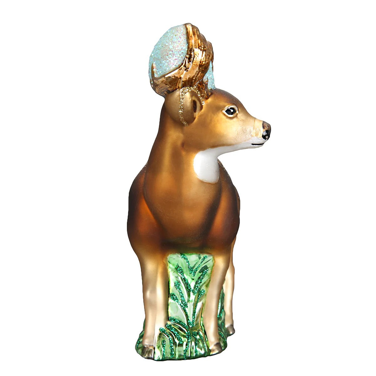 Mellow Monkey Whitetail Deer blown glass holiday ornament with gold antlers and blue glitter accents, standing on green glitter grass.